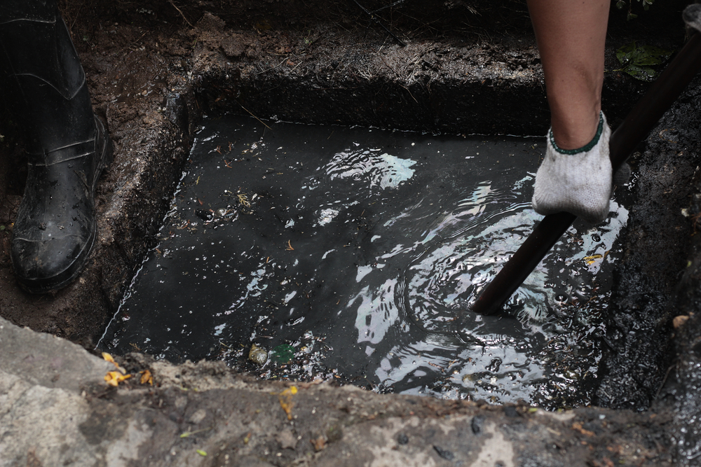 Moling Services South East team unblocking an outdoor drain using professional equipment in Kent and Sussex